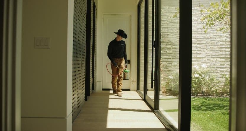 A pest control technician at a Phoenix-area home